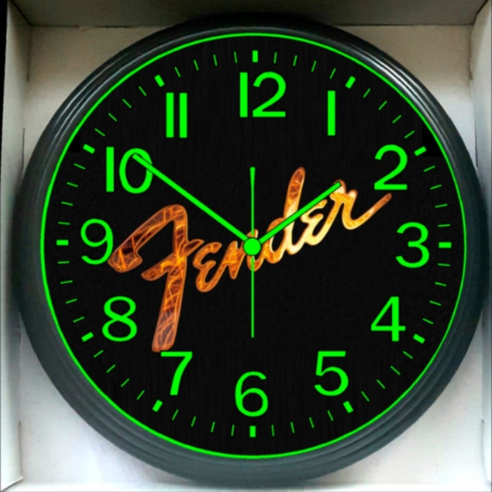 Fender Black Wall Clock with Green Numerals and Gold Logo